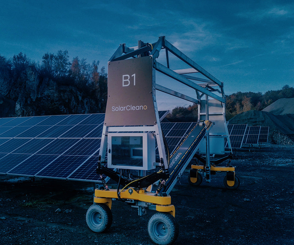 PVCARE SolarBridge B1 solar panel cleaning robot on solar panels with a scenic background