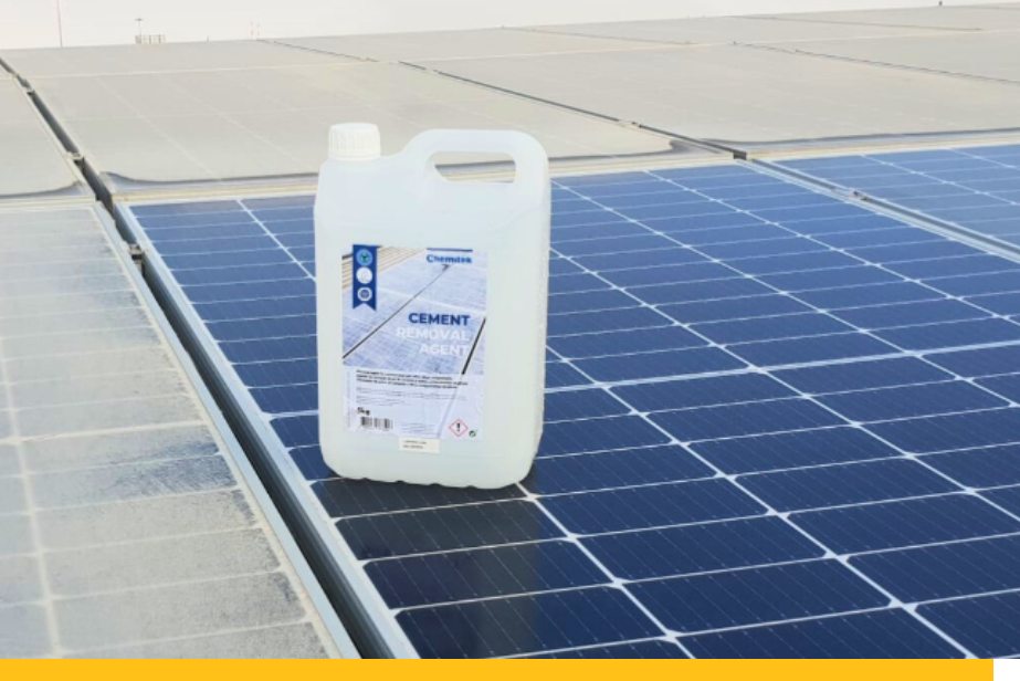 Cement Removal Agent plastic bottle with solar panels in backgroud