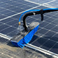 Solar cleaning brush with blue bristles cleaning a solar panel