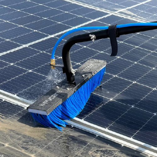 Solar cleaning brush with blue bristles cleaning a solar panel