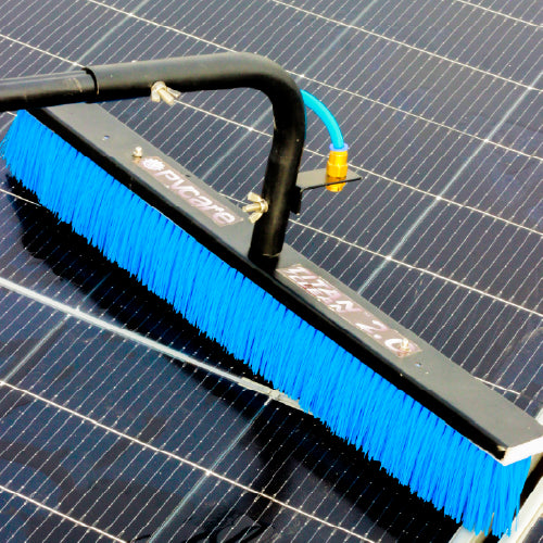 Solar Cleaning brush with blue bristles on a solar panel
