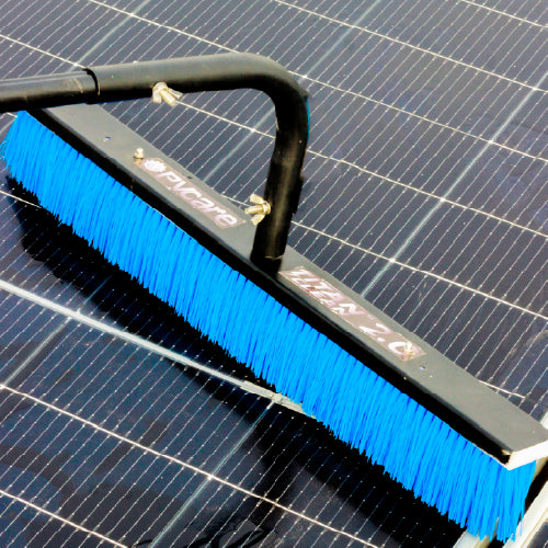 Solar Cleaning brush with blue bristles cleaning a solar panel